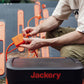 Person Plugging in Cables For Using the Power Station
