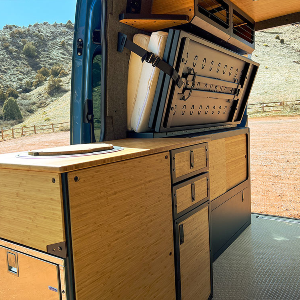 Grub Fridge Cab isntalled in van next to Murphy Bed System