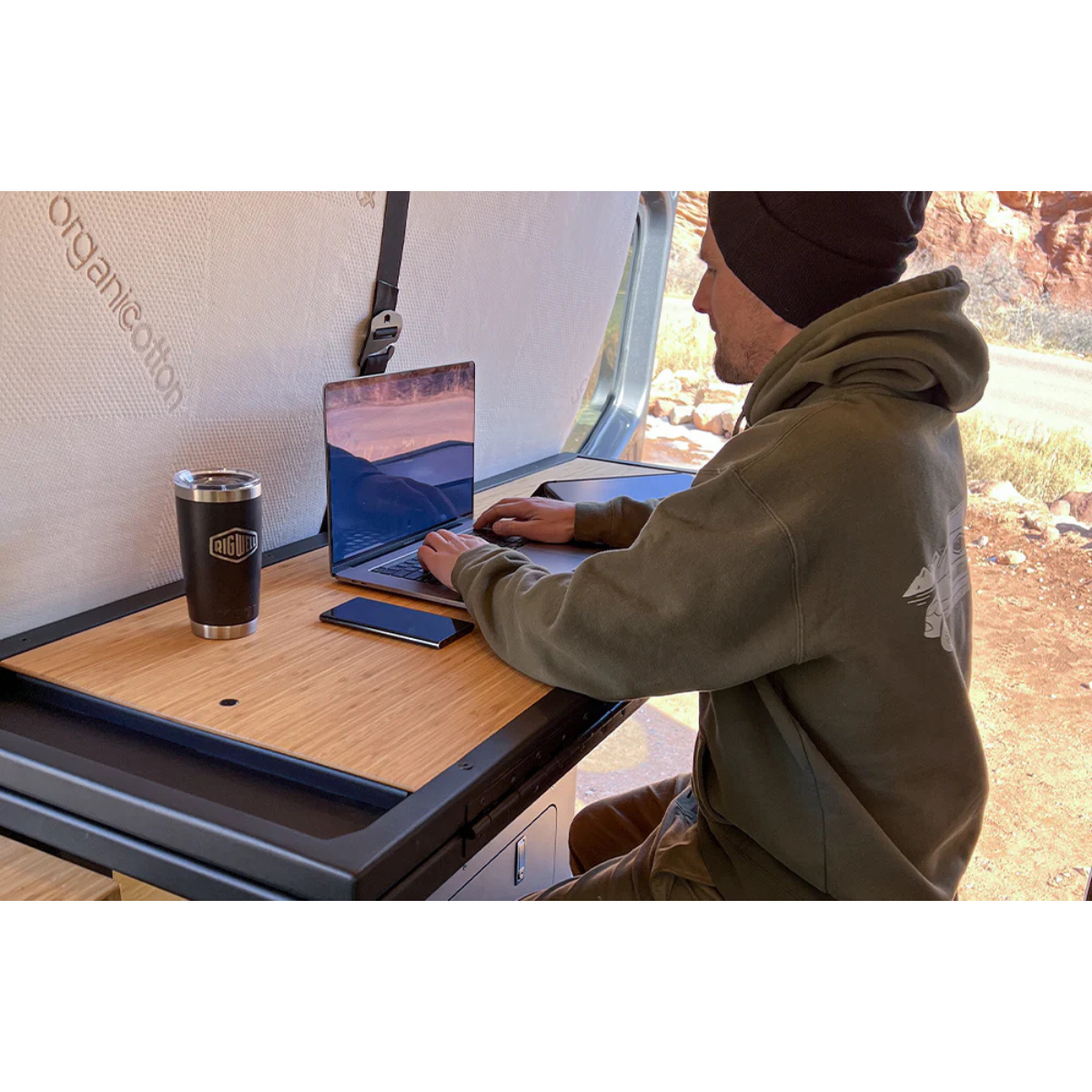 Person working on a folded up Murphy bed system with wood top
