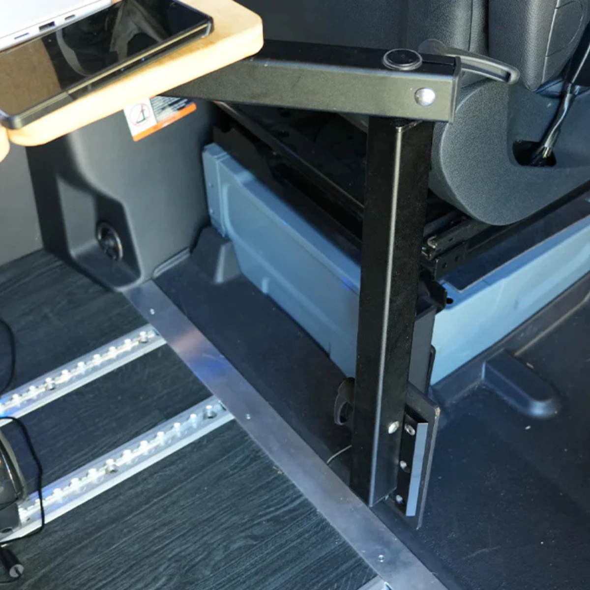 Installed seat base bracket with table